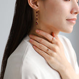 luxe Essence ロングピアス ガーネット ツイスト&オーバル